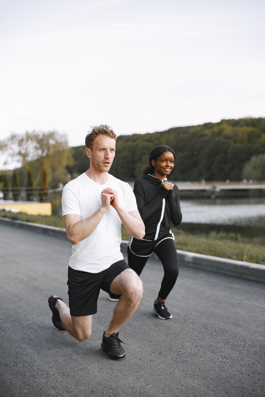woman and man doing warm up exercise
